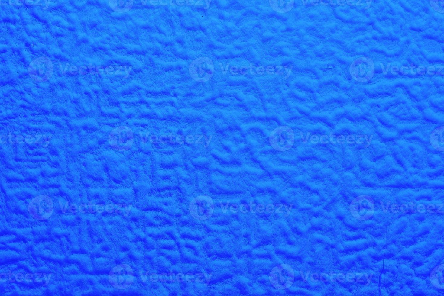 blue foam texture with uneven wavy surface, full frame photo