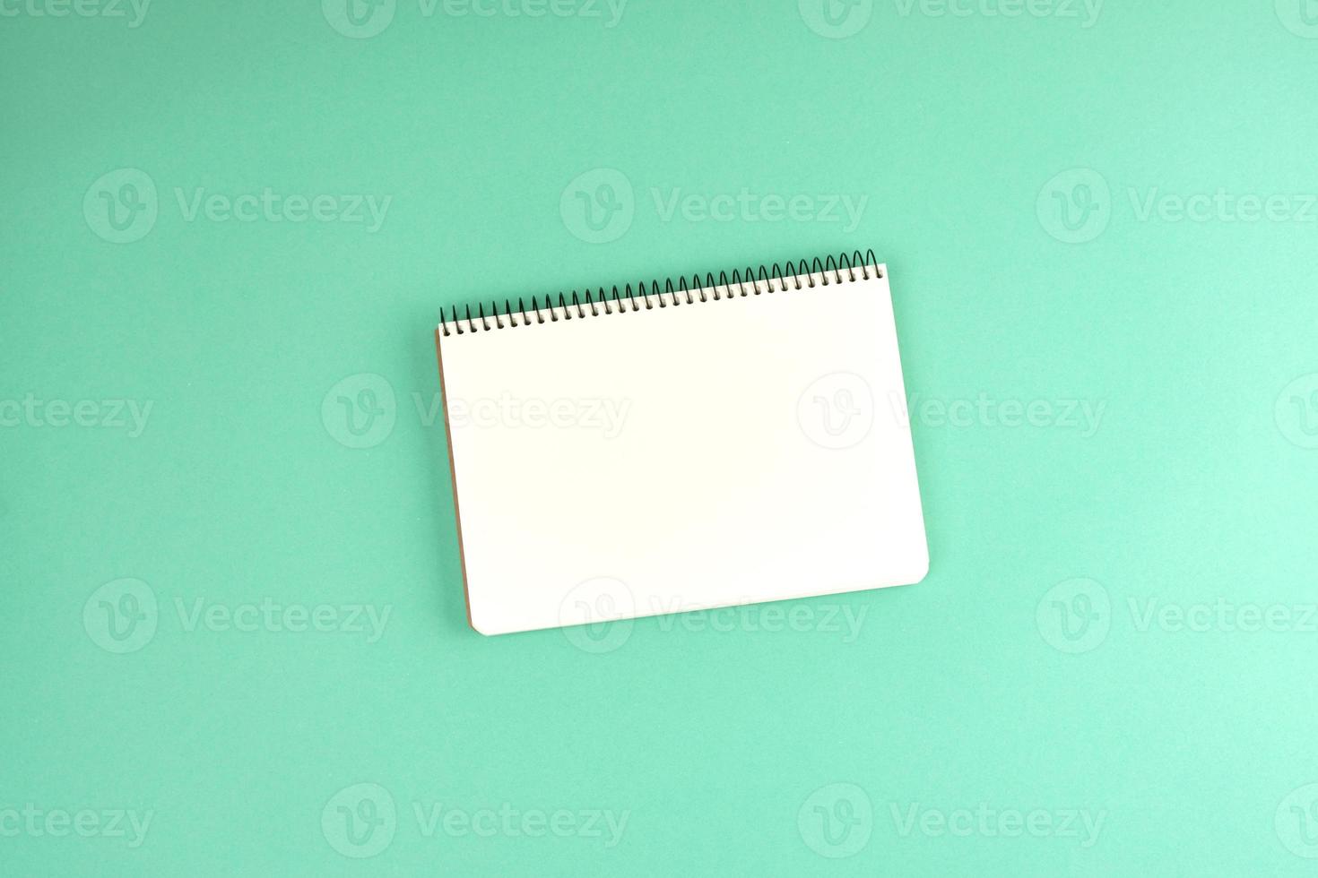 open spiral notebook with clean white sheets photo