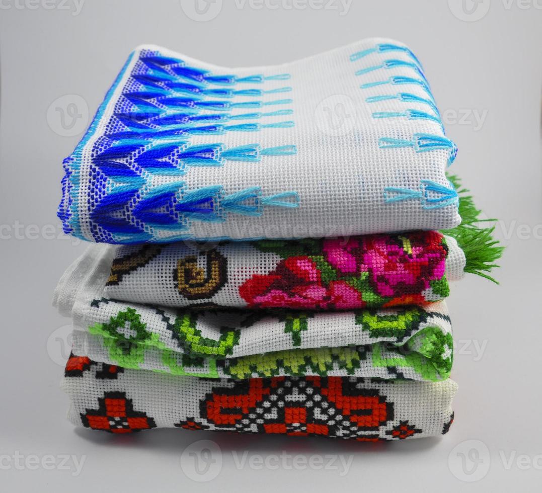 pile of embroidered towels photo