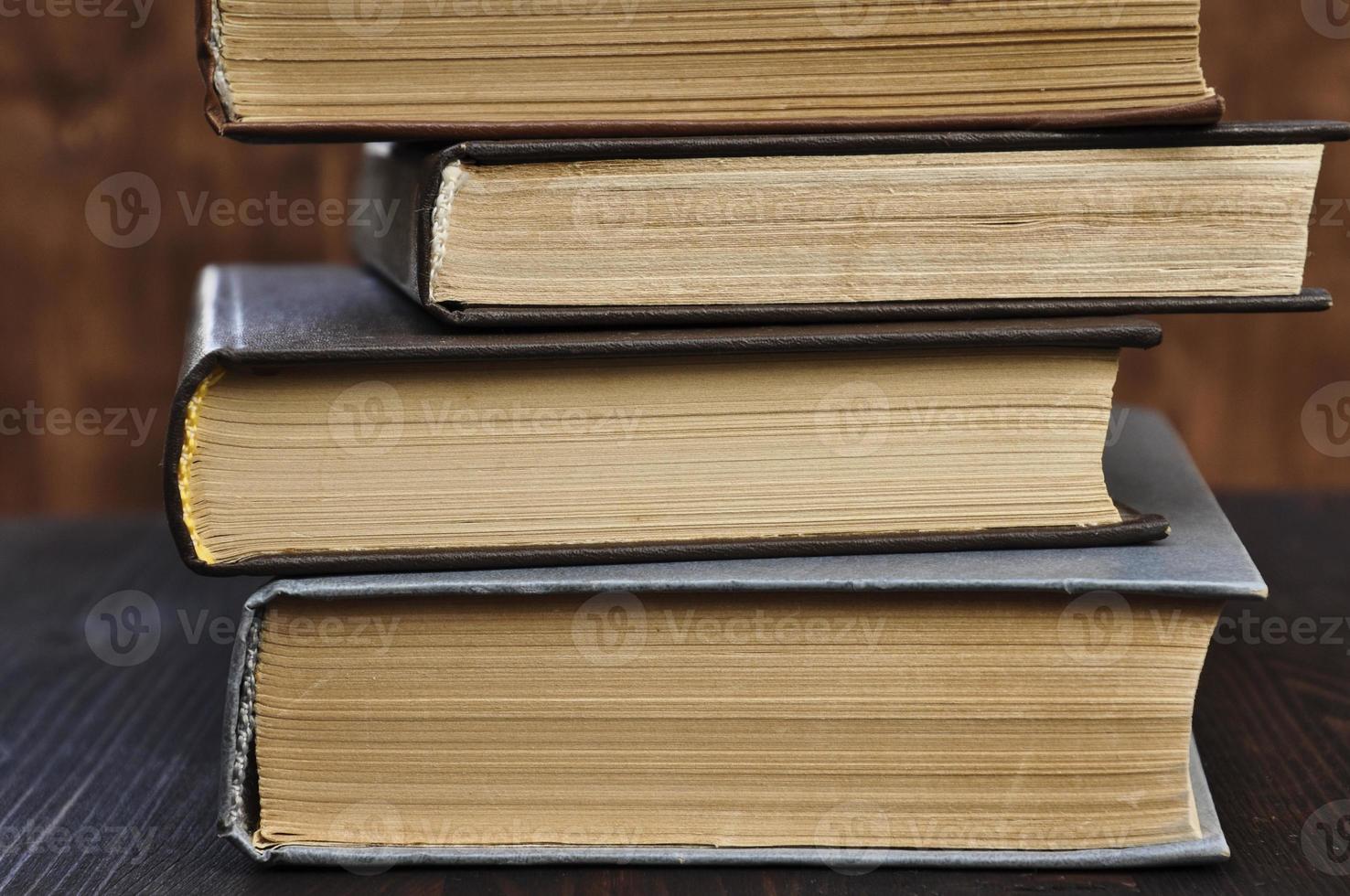 Four old books closed, close-up photo