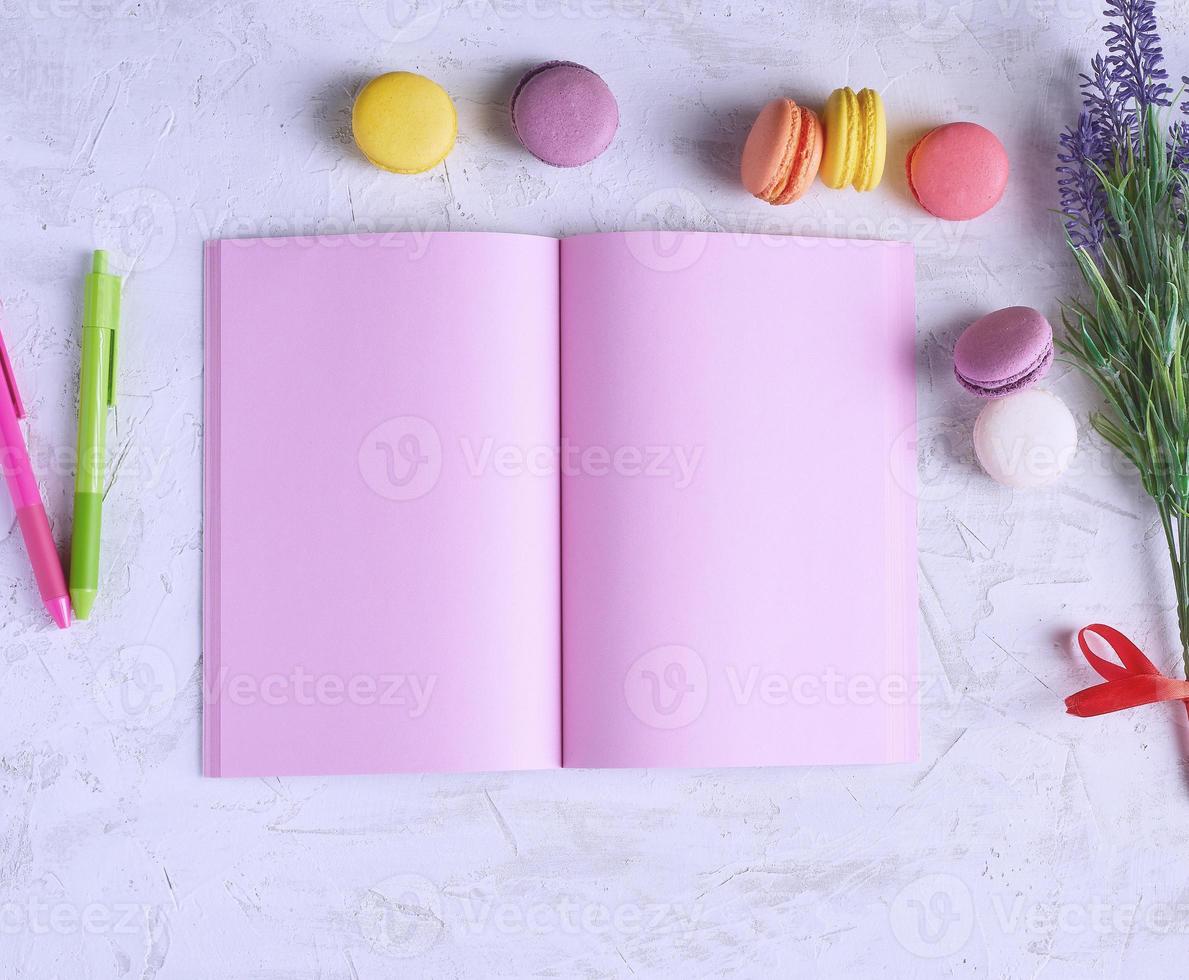 open notebook with blank pink pages and a bouquet of lavenders photo