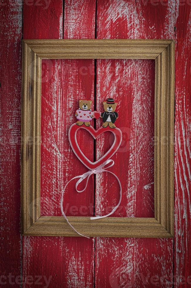 Festive red background with a wooden frame photo