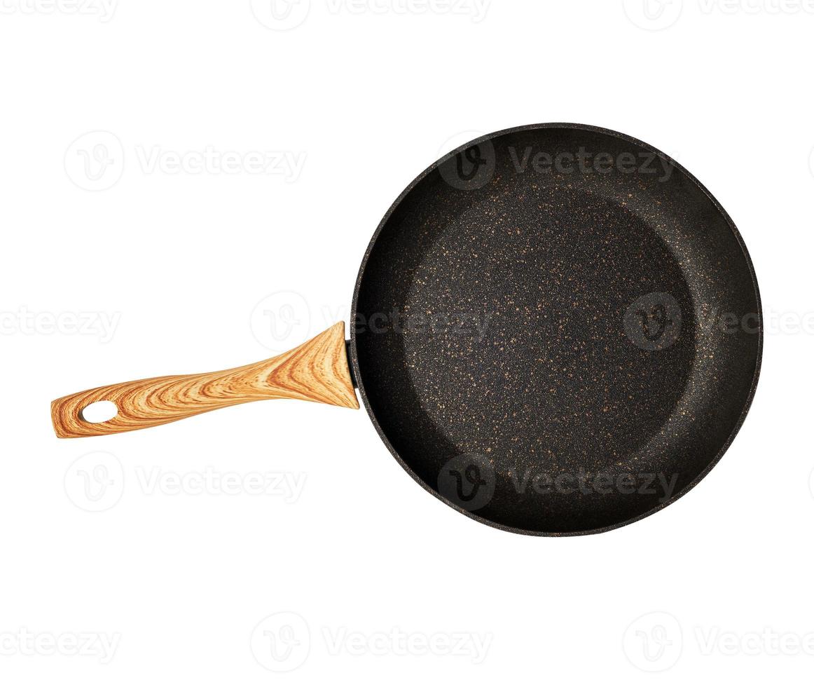 new empty frying pan with a brown handle isolated on a white background photo