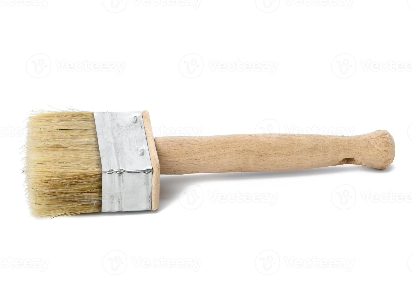 new paint brush with wooden handle isolated on white background photo