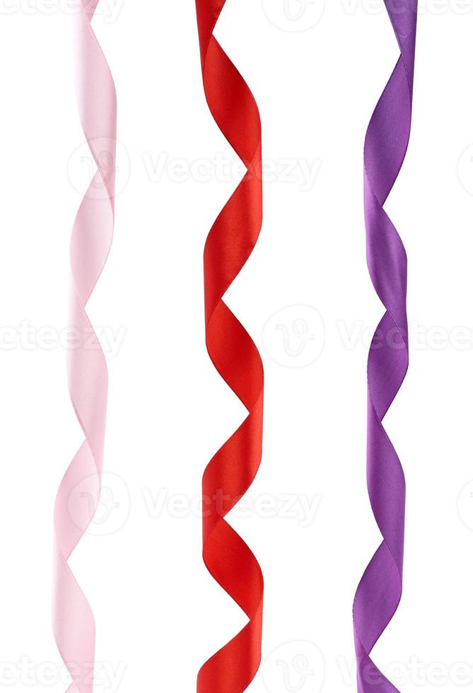 pink, red and purple satin twisted ribbons isolated on white background photo