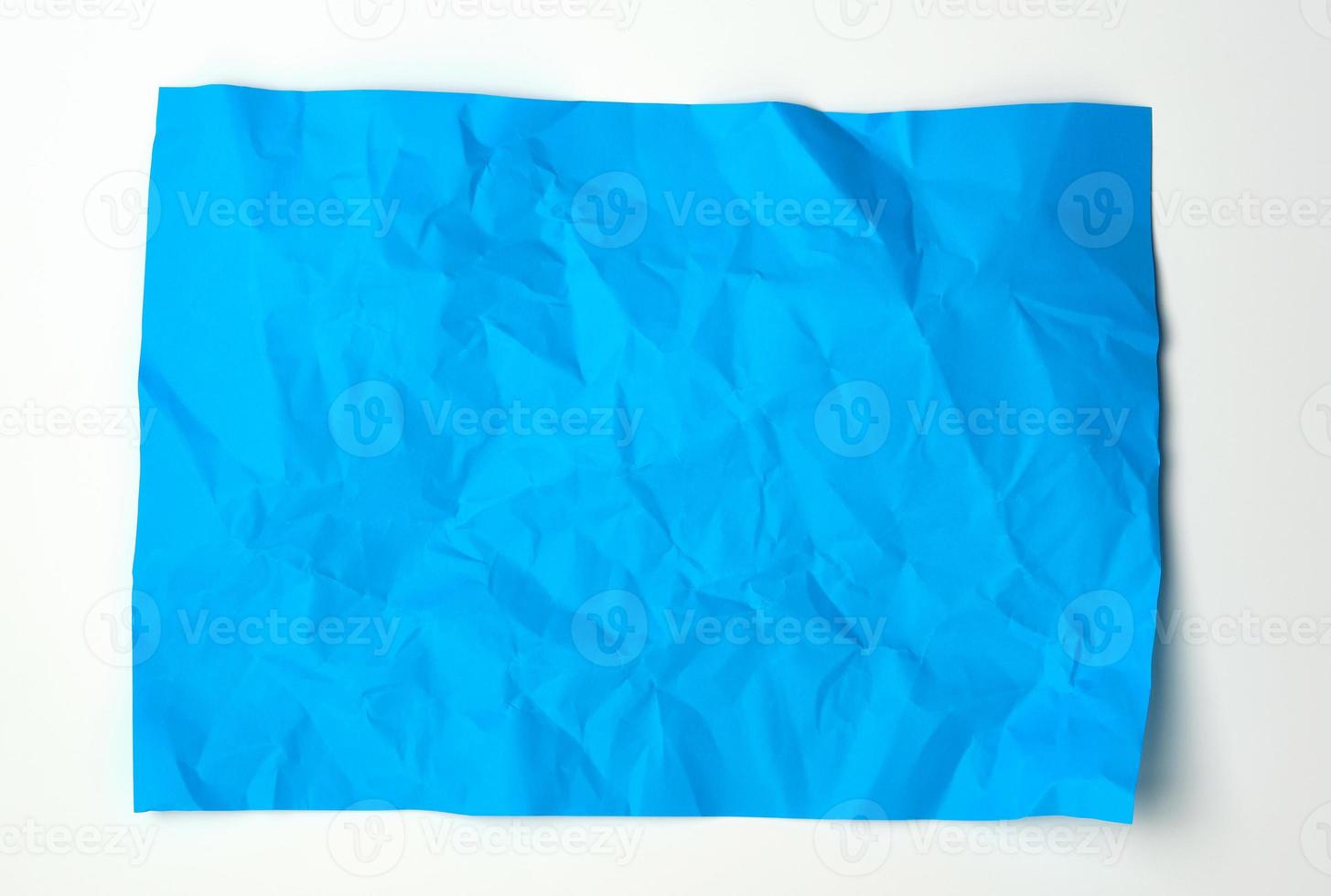 crumpled blue rectangular sheet of paper photo