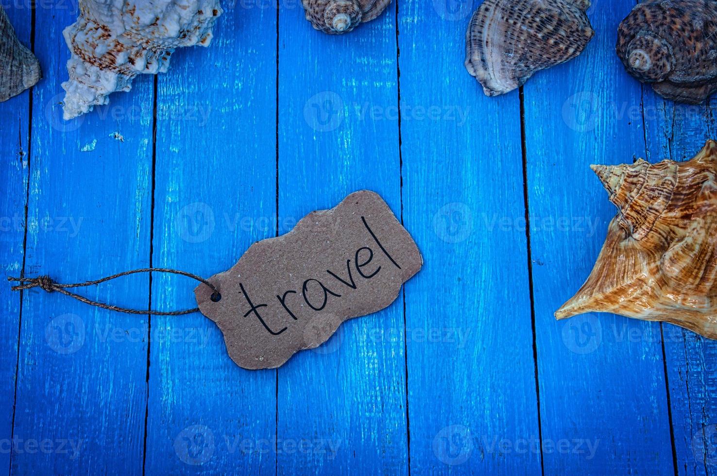 Blue wooden background with shells photo