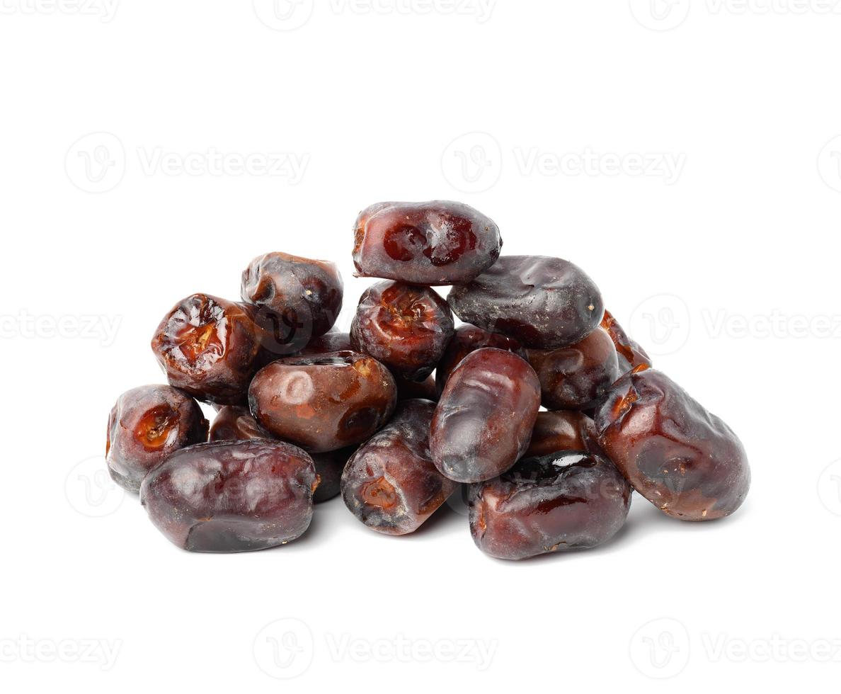 pile of dried dates on a white background, grade Mazafati, close up photo