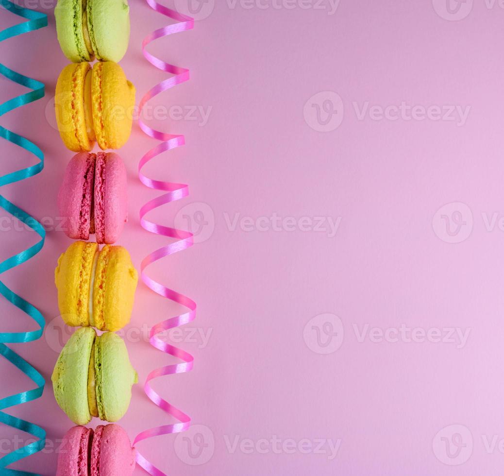 multicolored cakes of almond flour with cream macarons photo