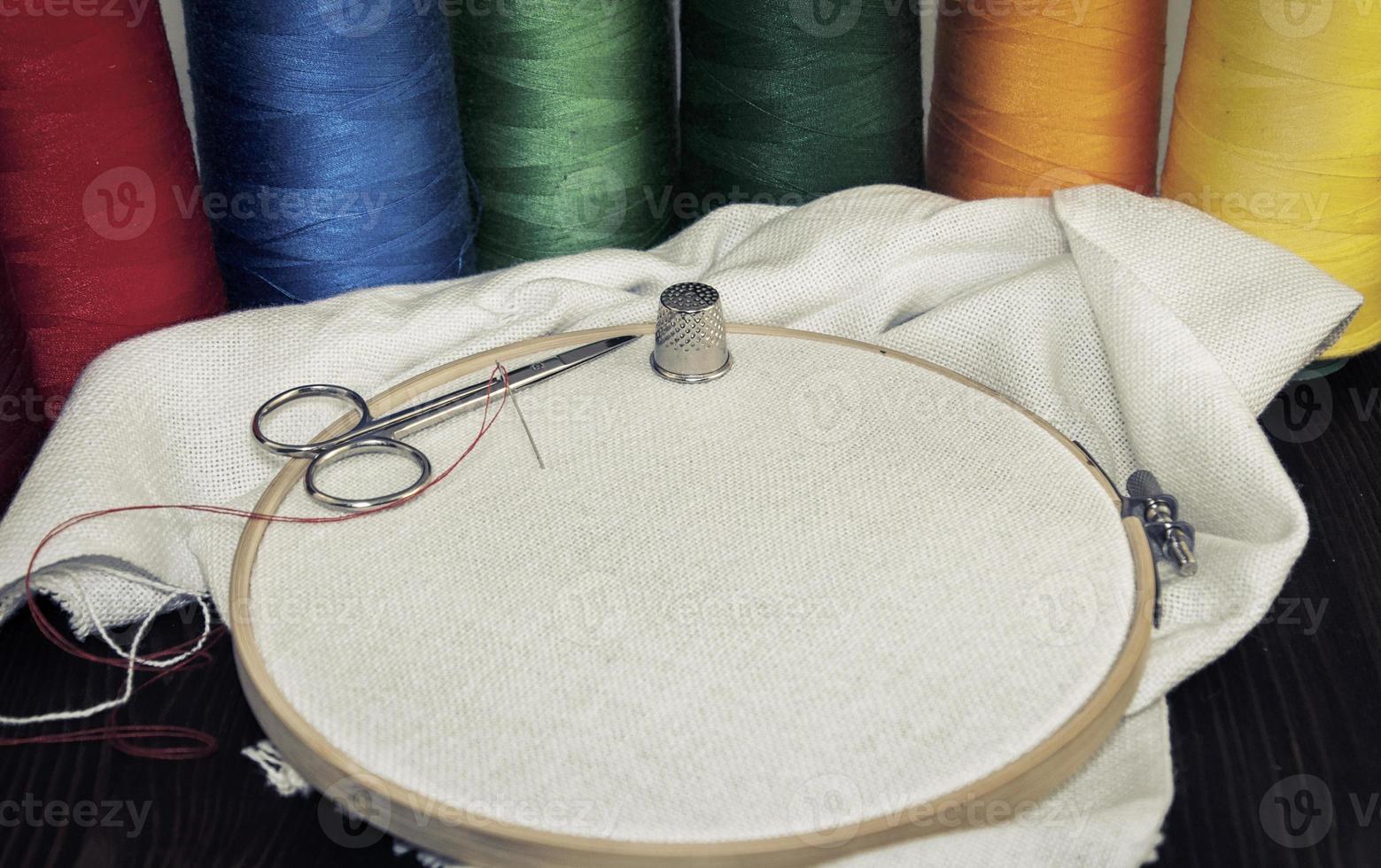 Round wooden hoop with a white cloth photo