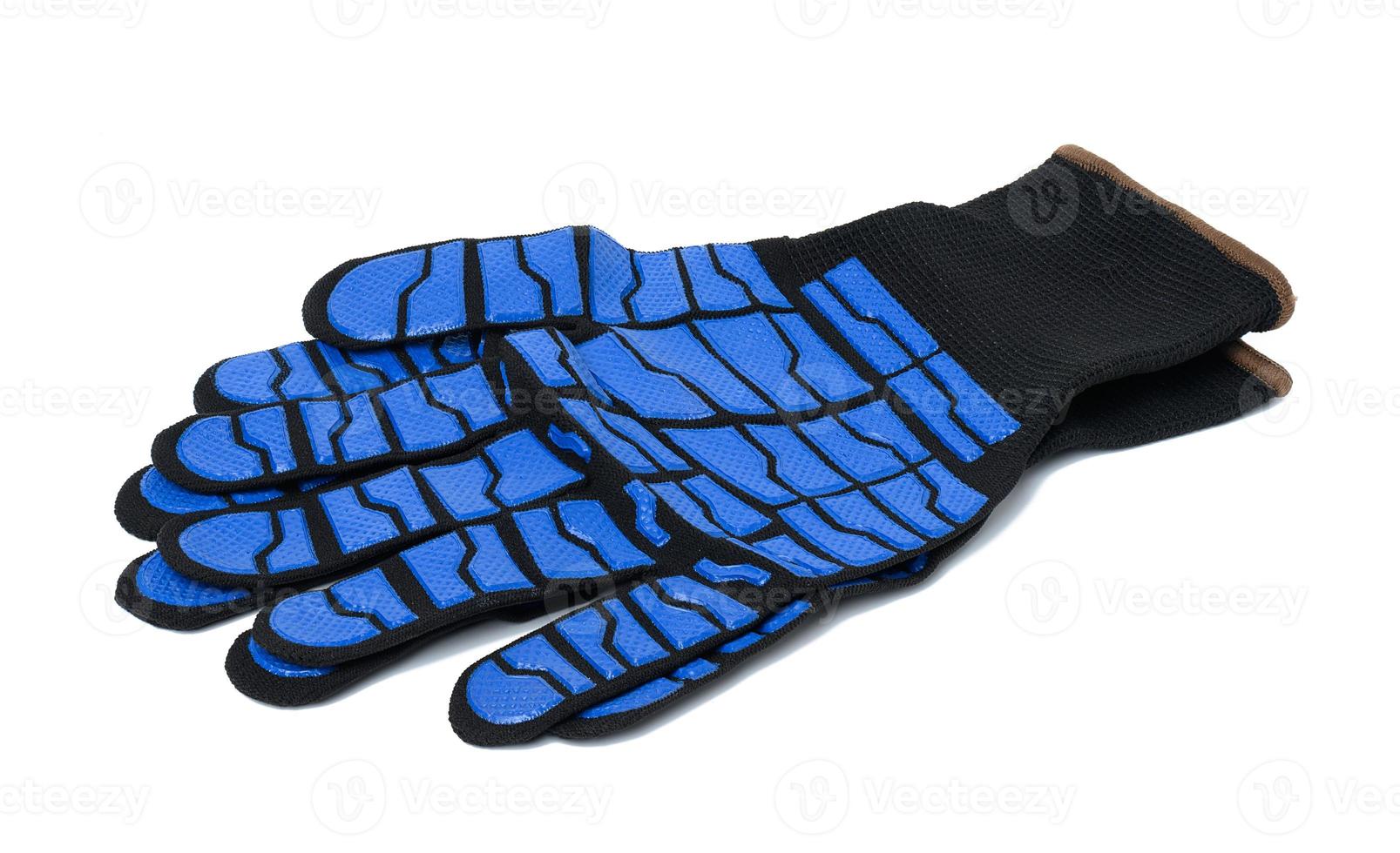 Knitted gloves with embossed latex coating to protect against mechanical damage and cuts. photo