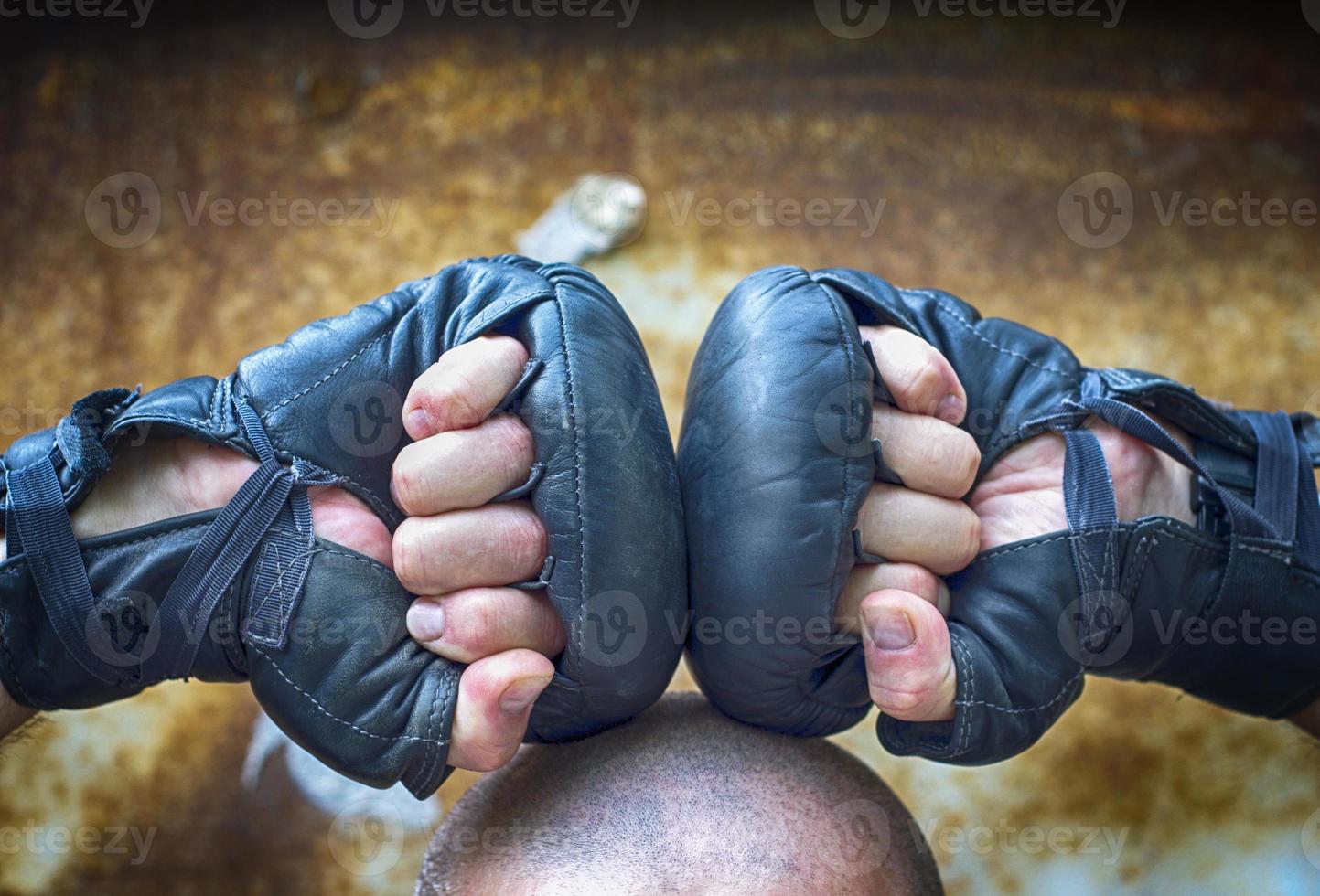 Two hands clenched in a fist gloves for boxing photo