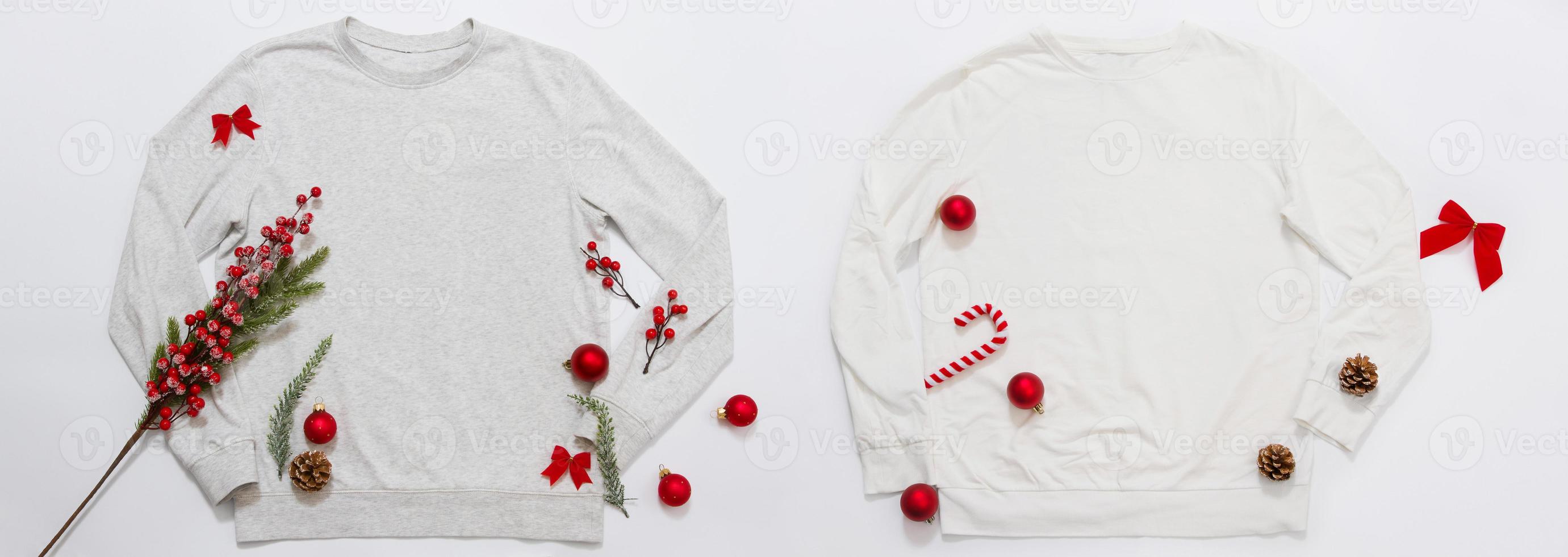 Banner Close up blank template shirt, gray sweatshirt hoodie with copy space. Christmas Holiday concept. Top view mockup sweater isolated on white background. Happy New Year decorations. Xmas jamper photo