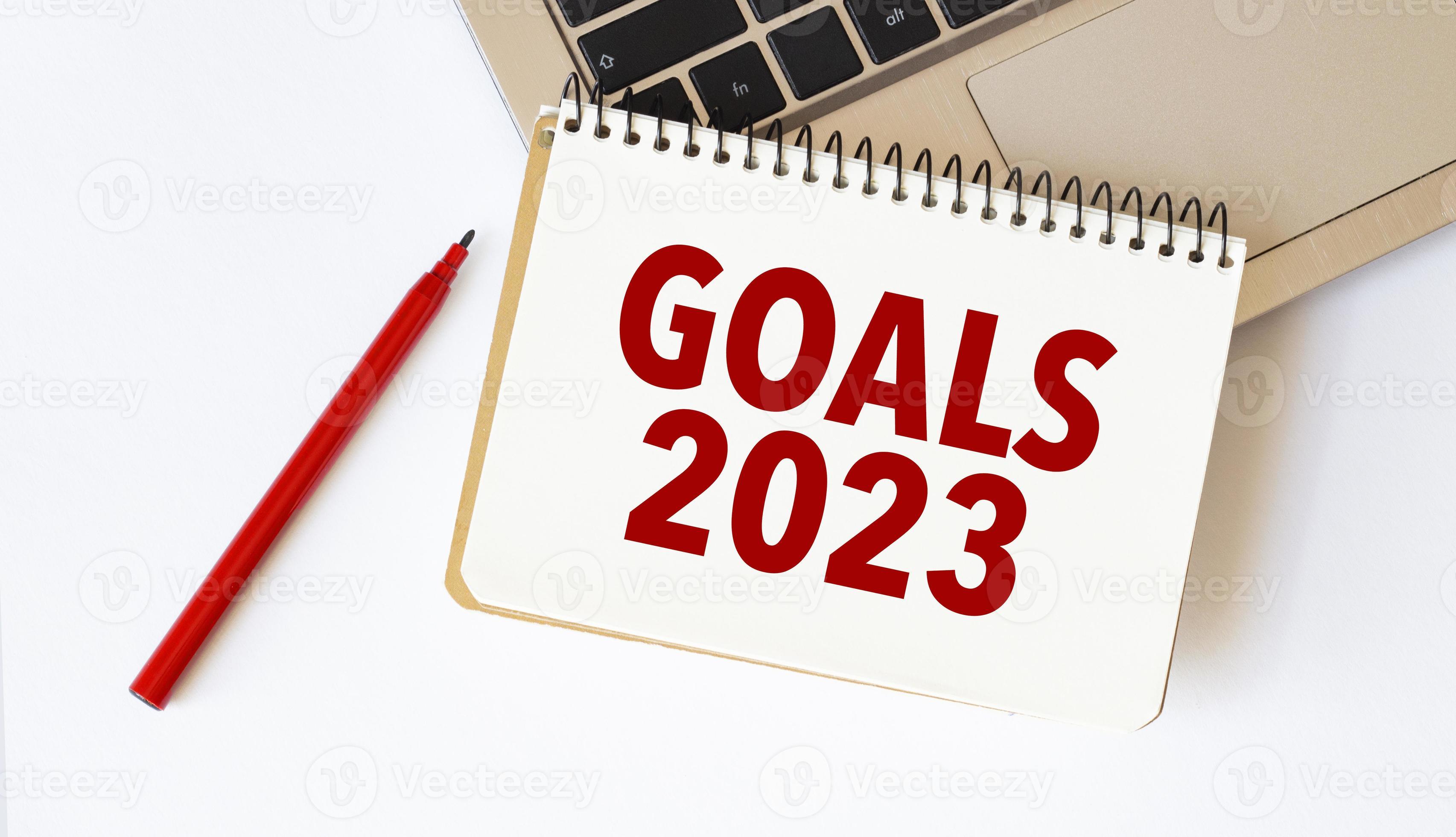 goals 2023 on notebook with red pencil and laptop 18966106 Stock Photo
