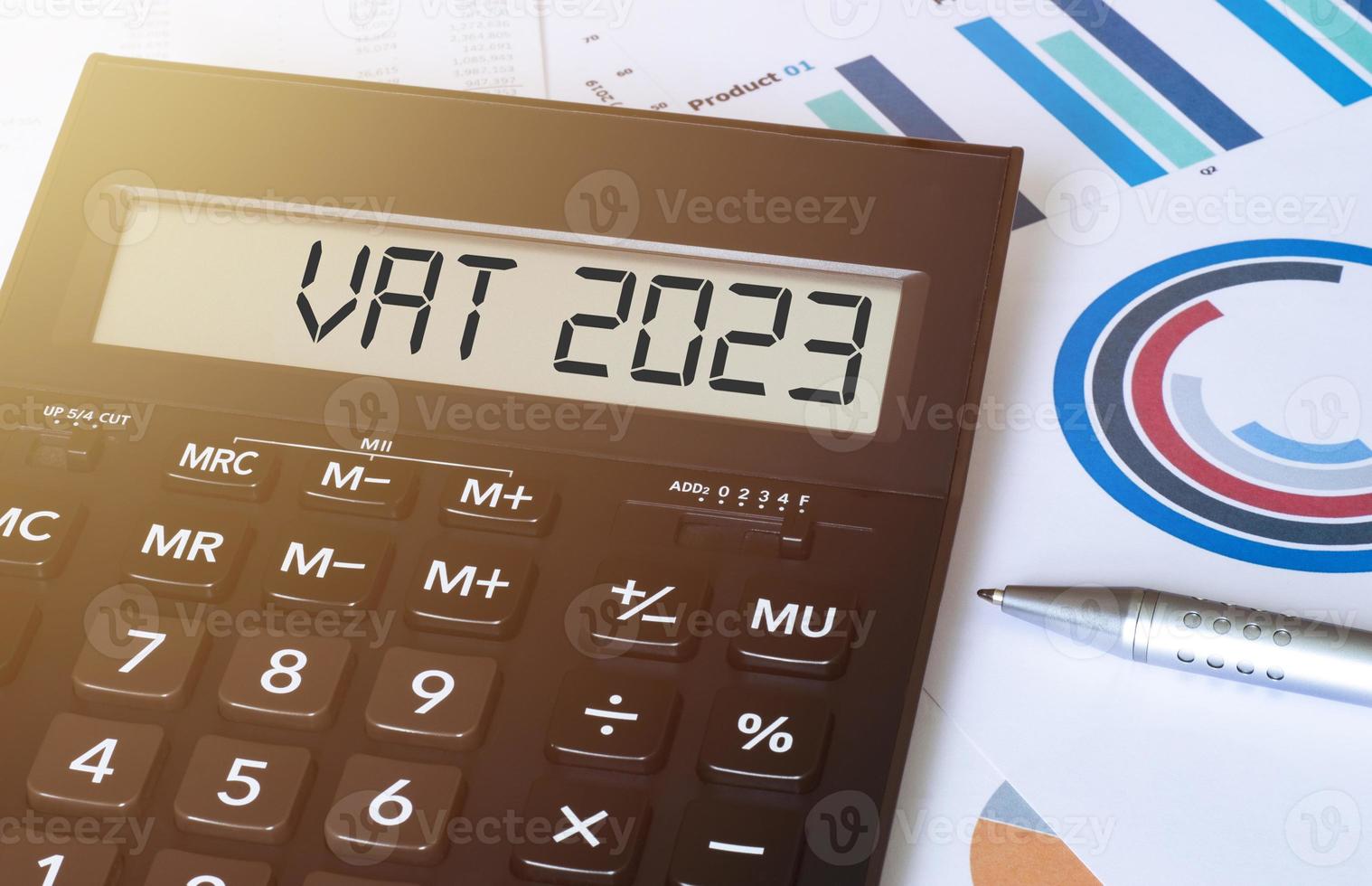 Word vat 2023 on calculator. Business and finance concept. photo
