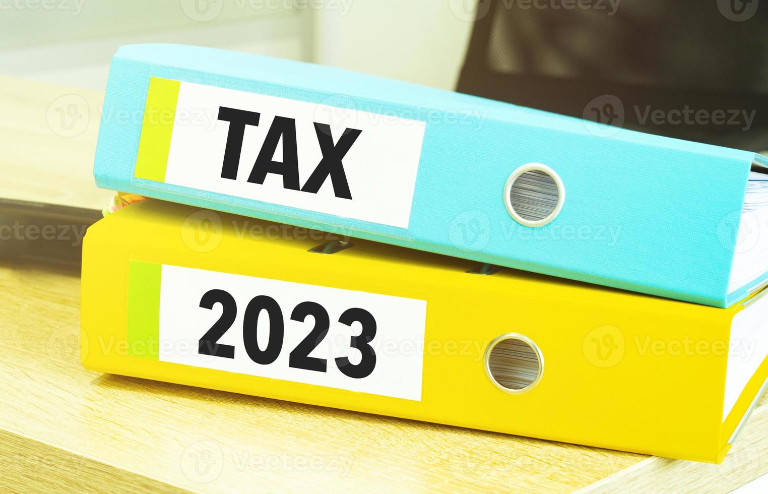 Two office folders with text tax 2023 photo