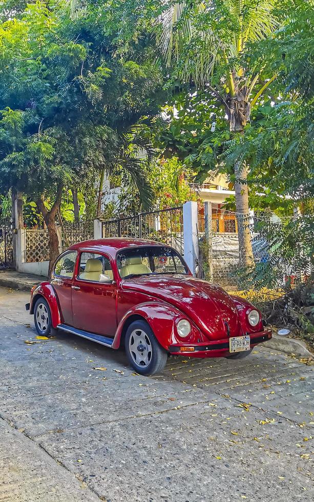 Puerto Escondido Oaxaca Mexico 2022 Various colorful tuned cars and classic vintage cars in Mexico. photo