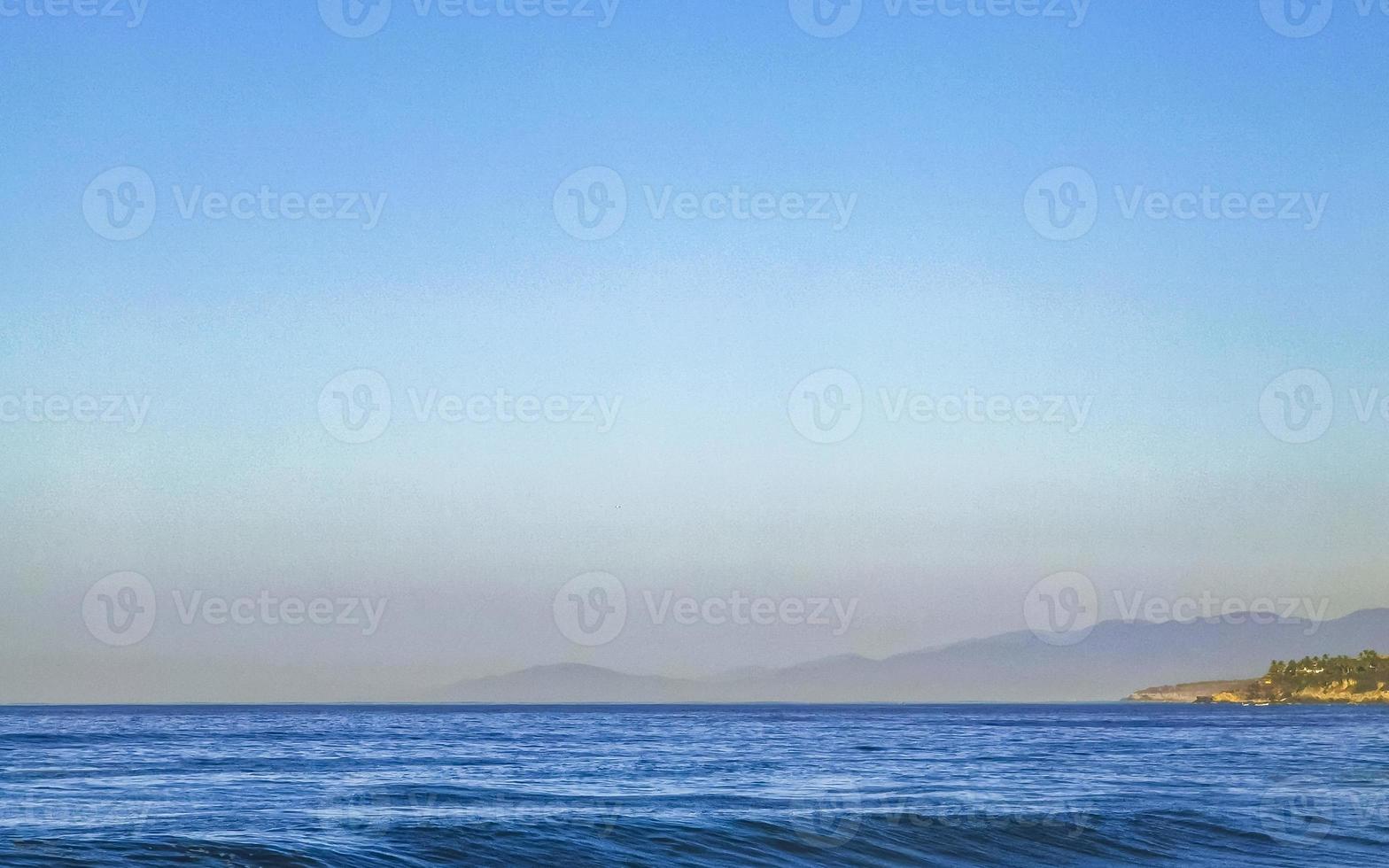 Beach sand blue water huge surfer waves Puerto Escondido Mexico. photo