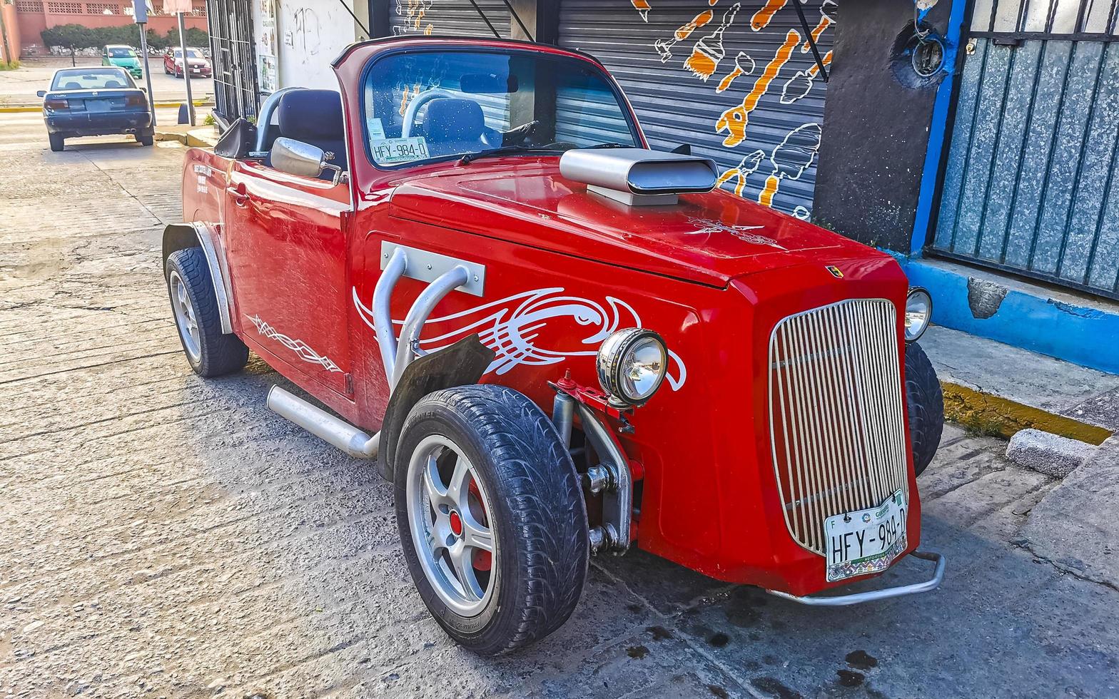Puerto Escondido Oaxaca Mexico 2022 Various colorful tuned cars and classic vintage cars  Mexico. photo
