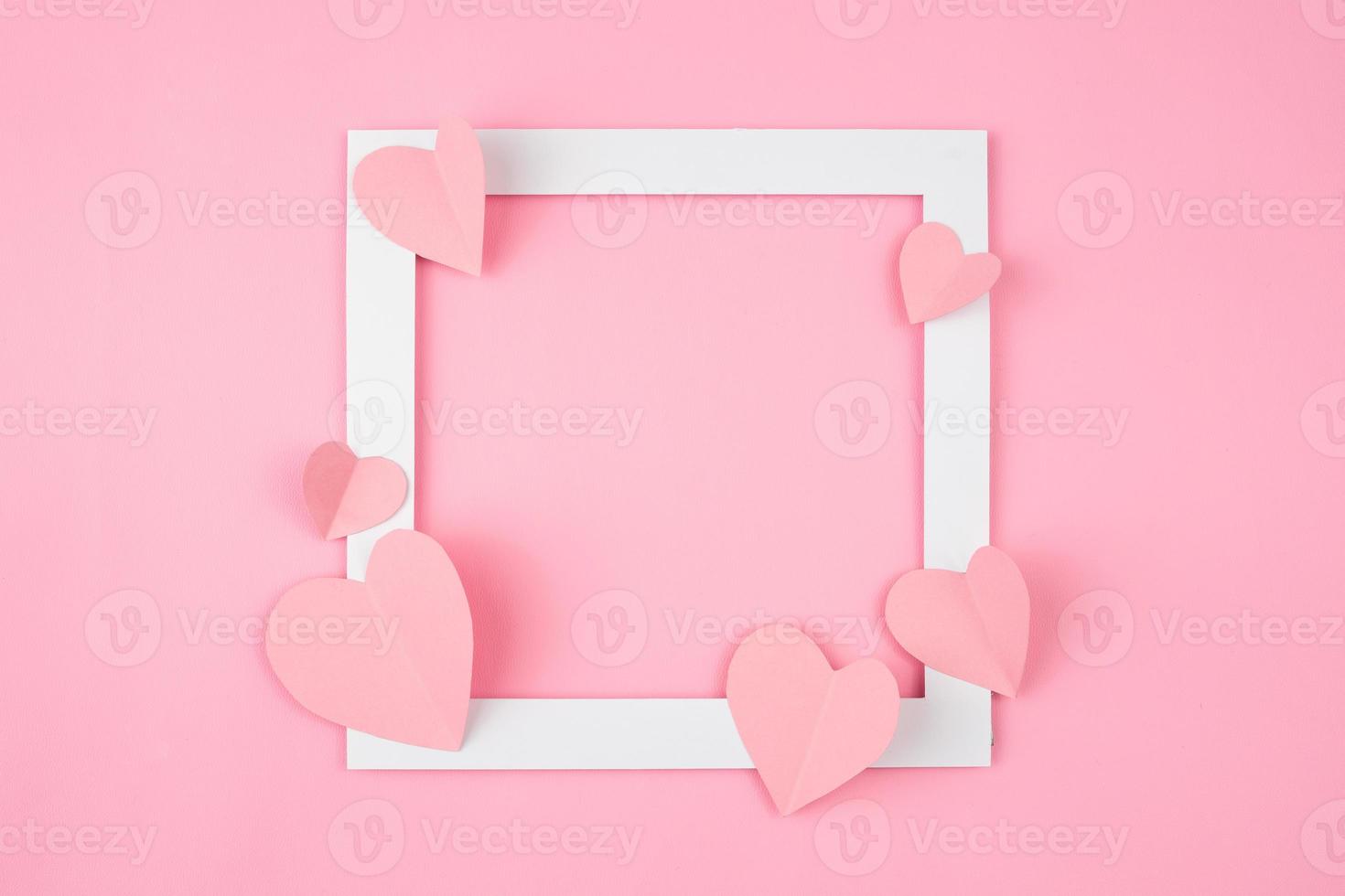 square frame with pink love shape for text copy space. valentine and romantic background design photo