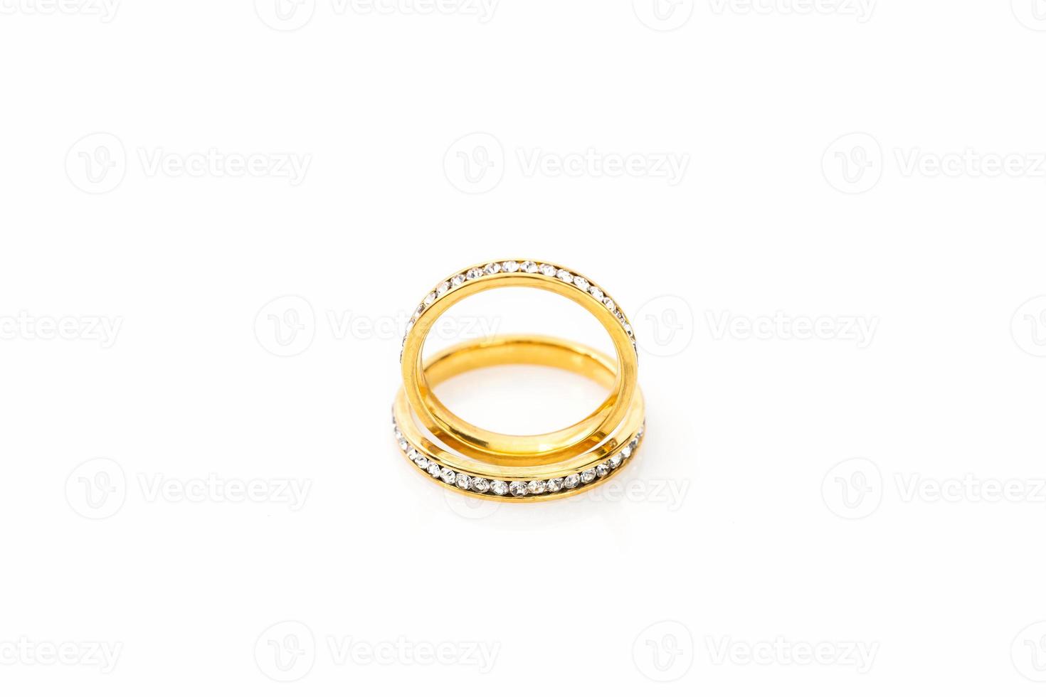 Gold wedding rings on white background photo