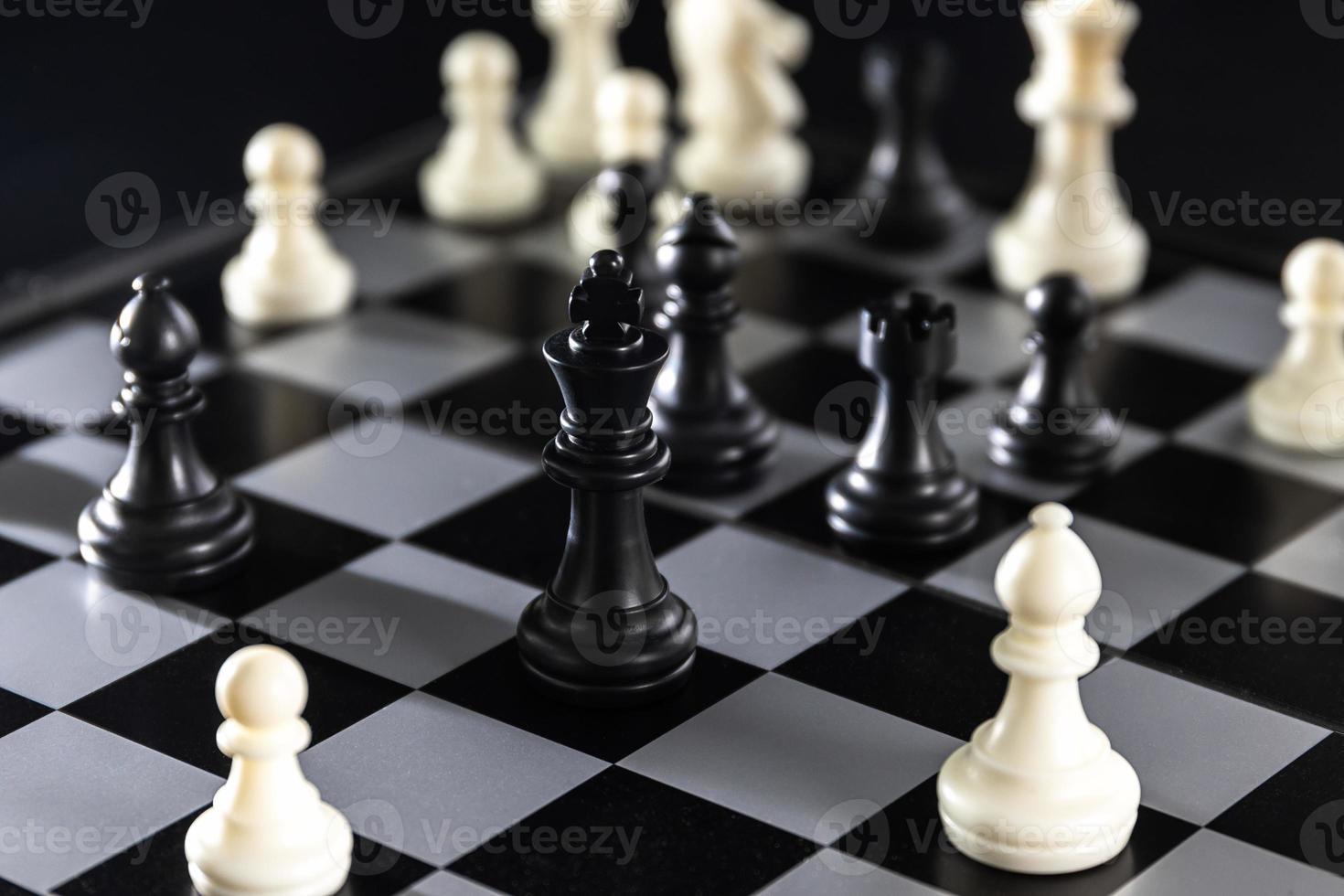 Chess pieces on chessboard photo
