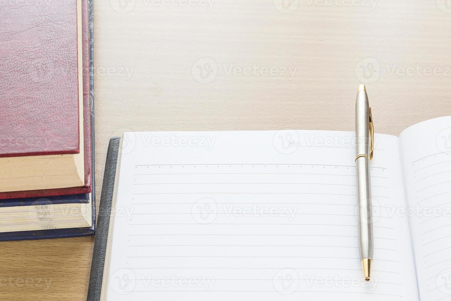 Pen put on notebook open blank page photo