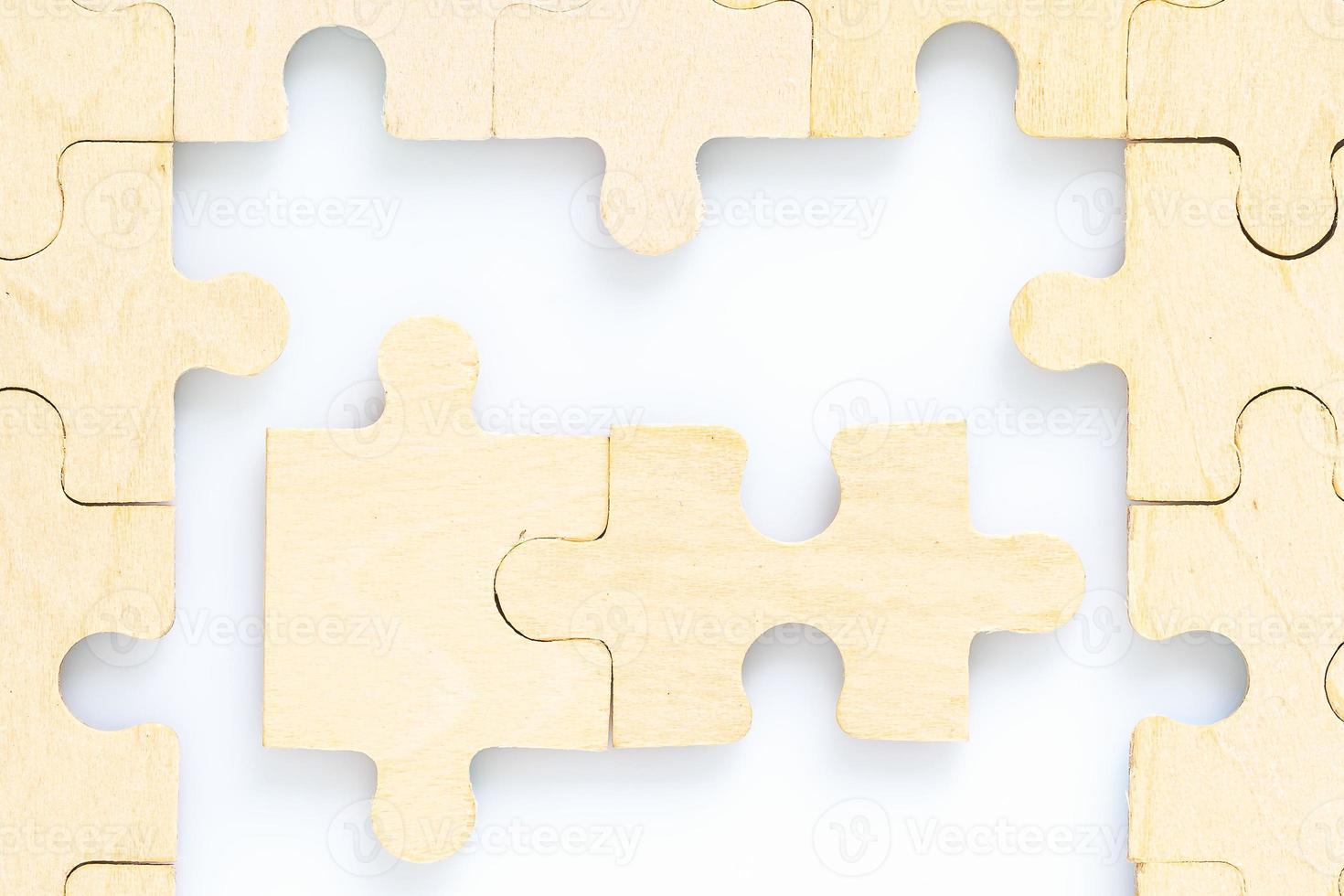 wooden jigsaw puzzle pieces on white background photo