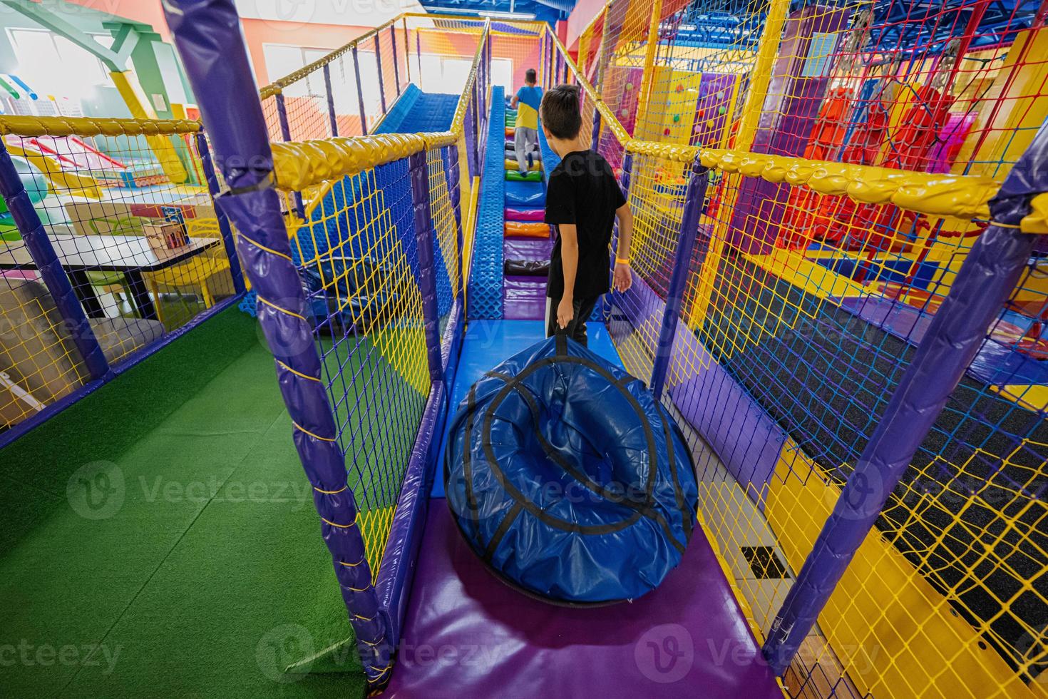Kids playing at indoor play center playground in tubes. 18973307 Stock