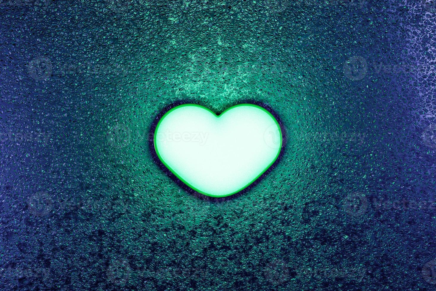 Green neon light heart dark concept photo