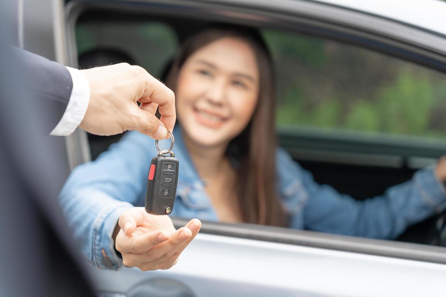 lease, rental car, sell, buy. Dealership manager send car keys to the new owner.  Sales, loan credit financial, rent vehicle, insurance,  renting, Seller, dealer, installment, car care business photo