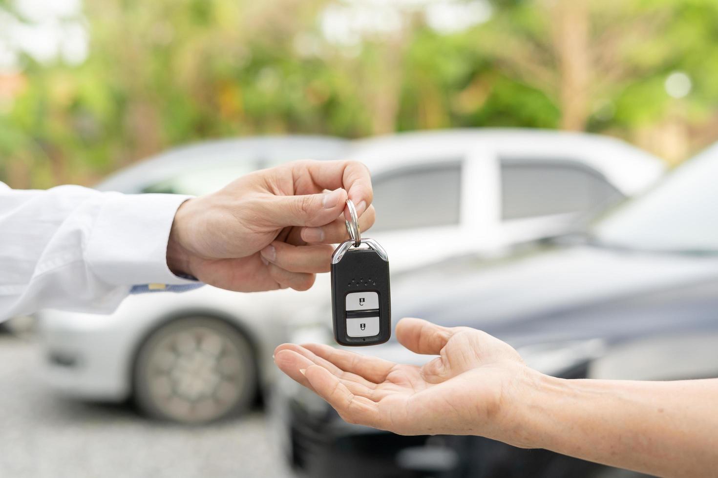 lease, rental car, sell, buy. Dealership manager send car keys to the new owner.  Sales, loan credit financial, rent vehicle, insurance,  renting, Seller, dealer, installment, car care business photo