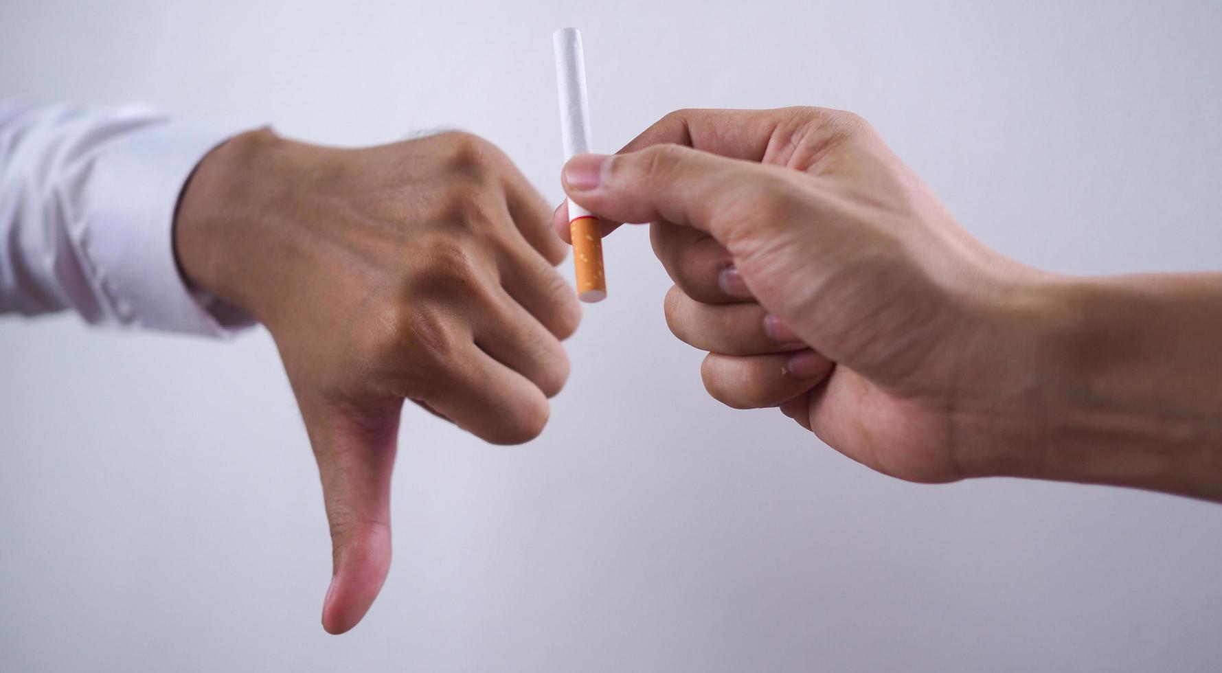 The hand rejected the cigarette that was handed over. Smoking Concepts Causes of Lung Cancer. Just say no photo