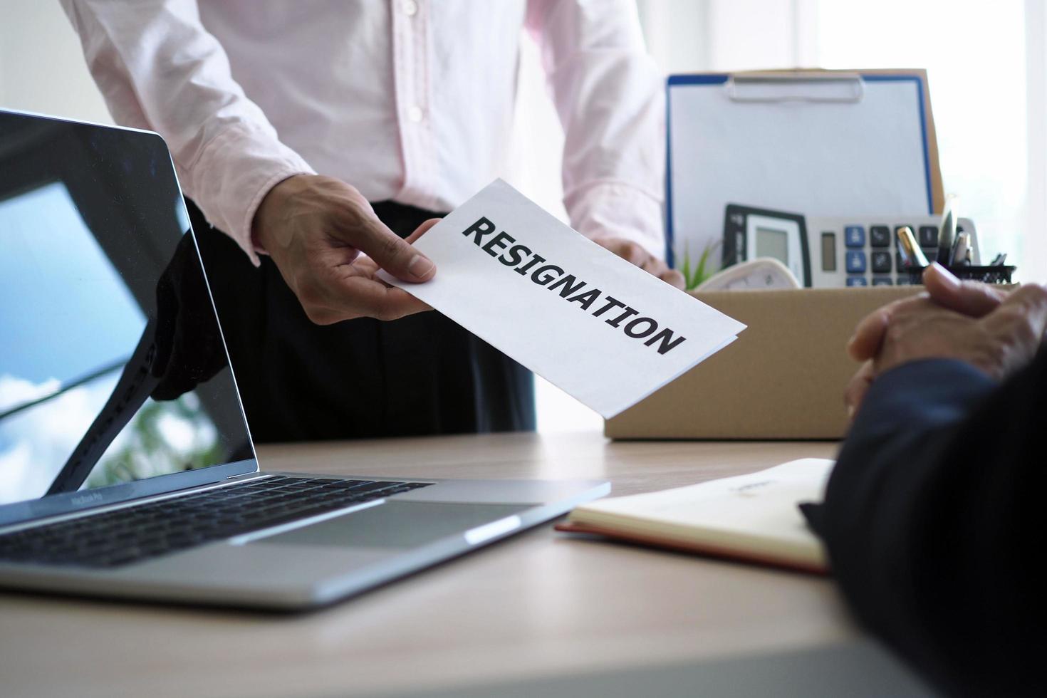 Employees have personal storage boxes on their side. And send a resignation letter to the manager. Changing jobs, relocating positions photo