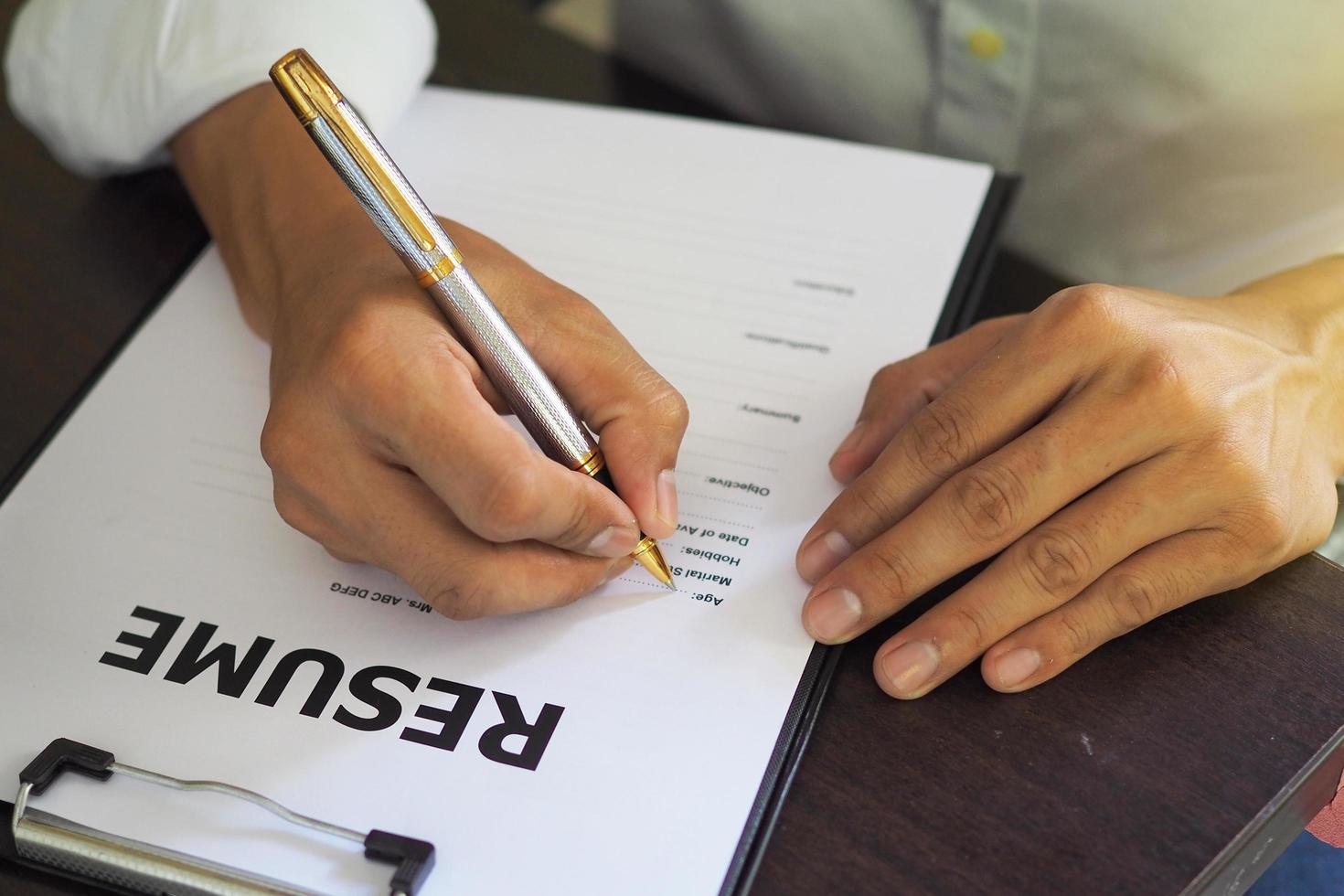 Job seekers are filling out their resume.  Job Application Form photo