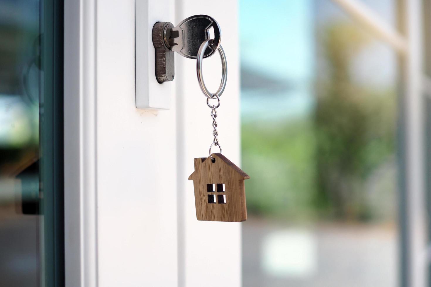 The house key for unlocking a new house is plugged into the door. photo