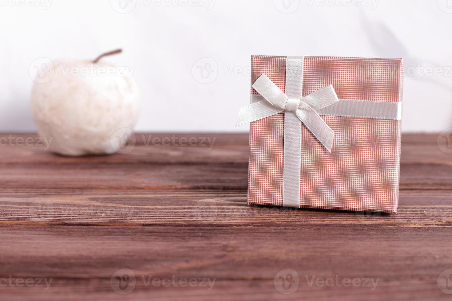 Gift box on wooden background, copy space photo