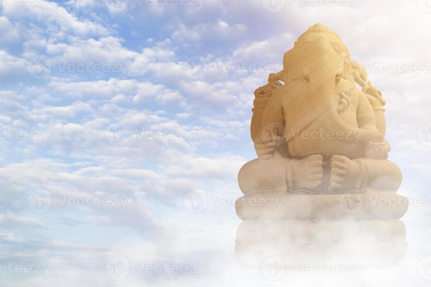 Selective focus on statue of Lord Ganesha, Ganesha Festival. Hindu religion and Indian celebration of Diwali festival concept on dark, red, yellow background. photo