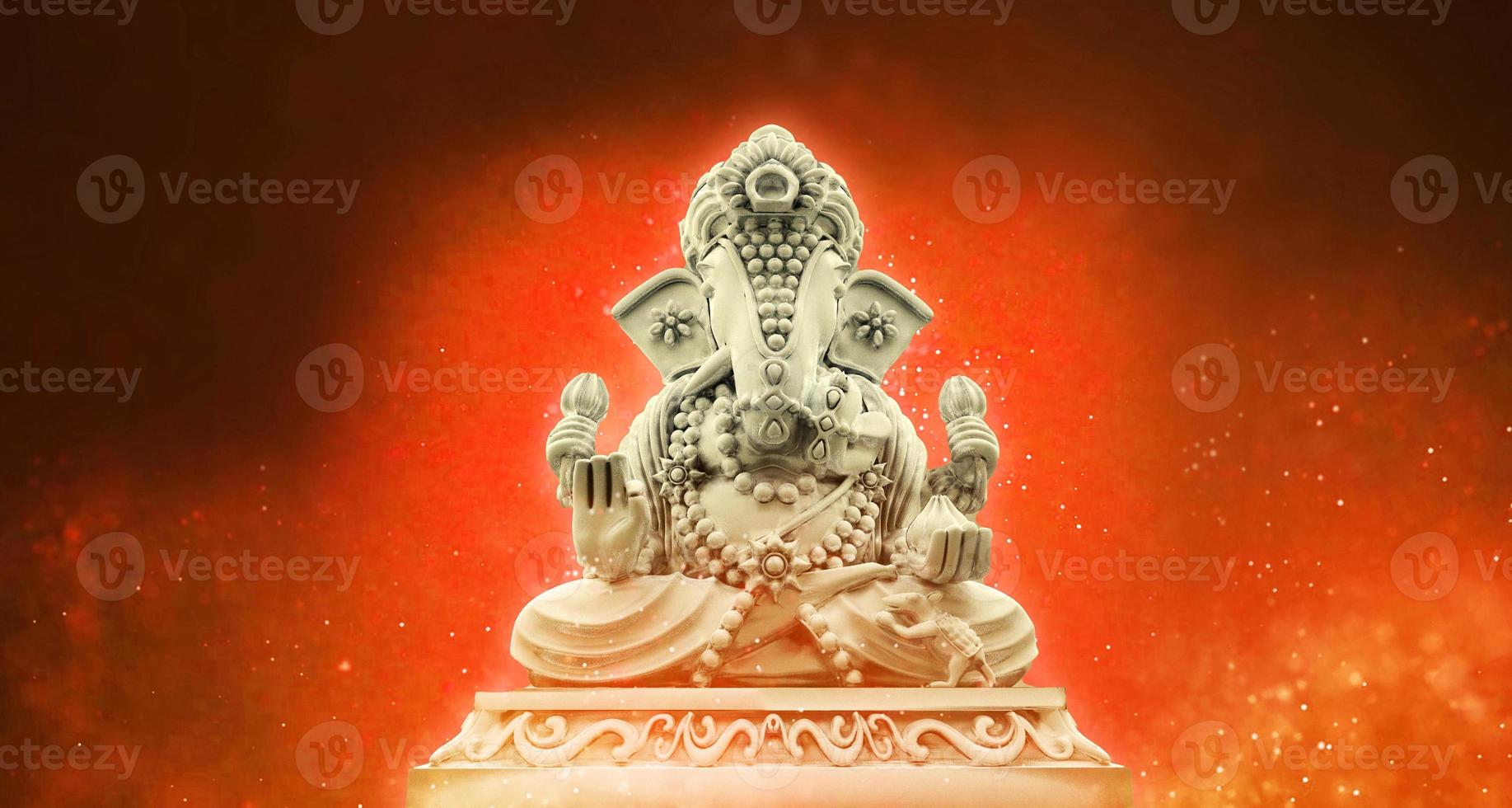 Selective focus on statue of Lord Ganesha, Ganesha Festival. Hindu religion and Indian celebration of Diwali festival concept on dark, red, yellow background. photo