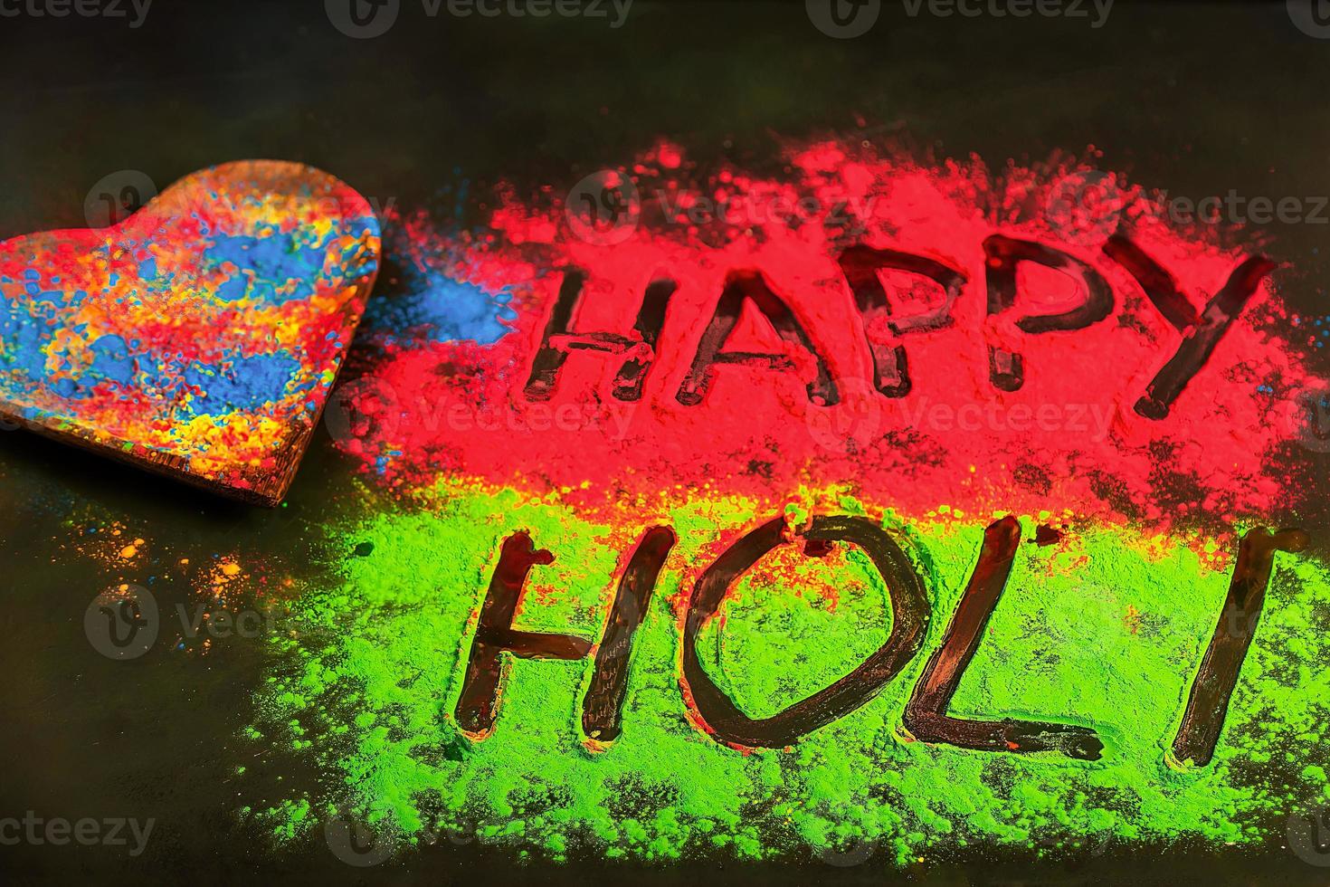 Holi background with colored powder. Holi festival, traditional Indian holiday. Happy holi lettering. photo