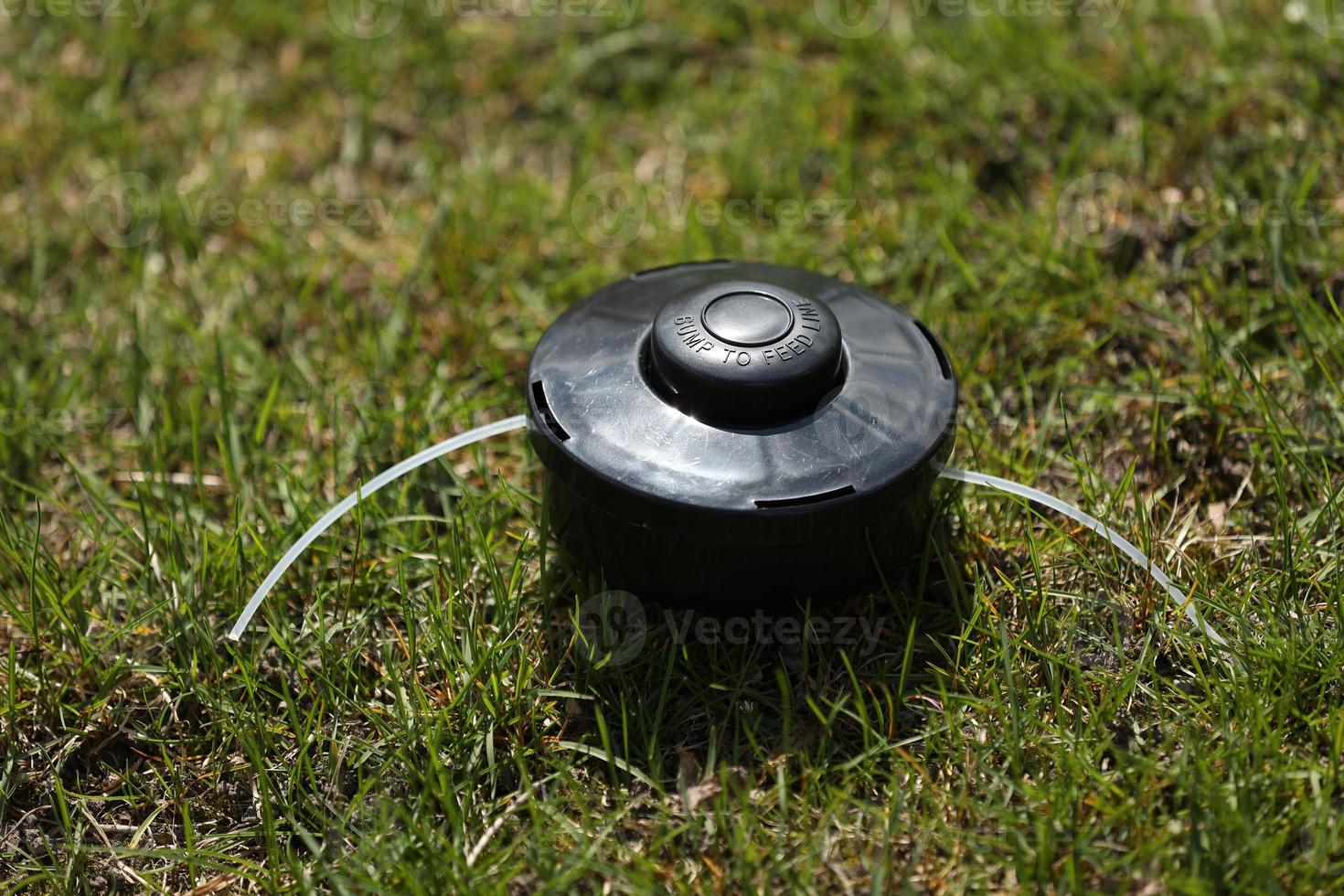 automatic sprinkler system watering the lawn on a background of green grass, close up photo