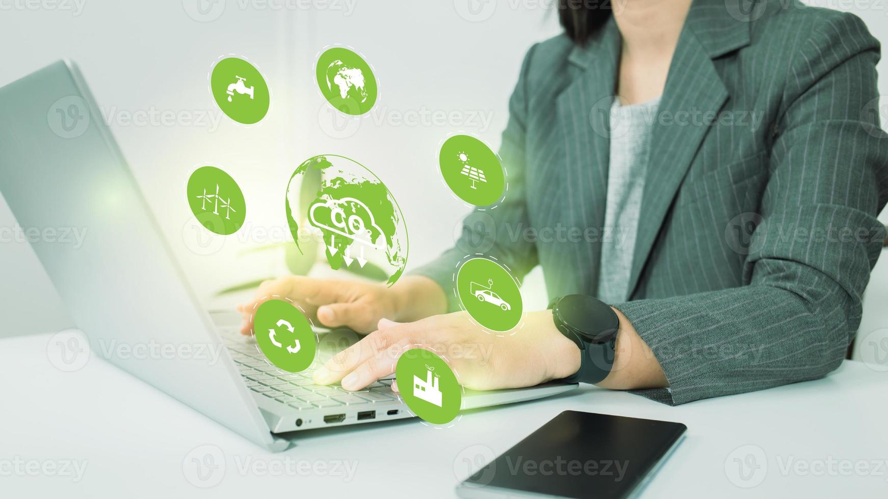 Business woman use computer to analyze Co2, CO2 environmental social governance investment business concept. Co2 icons pop up on the computer screen in business investment strategy concept. photo