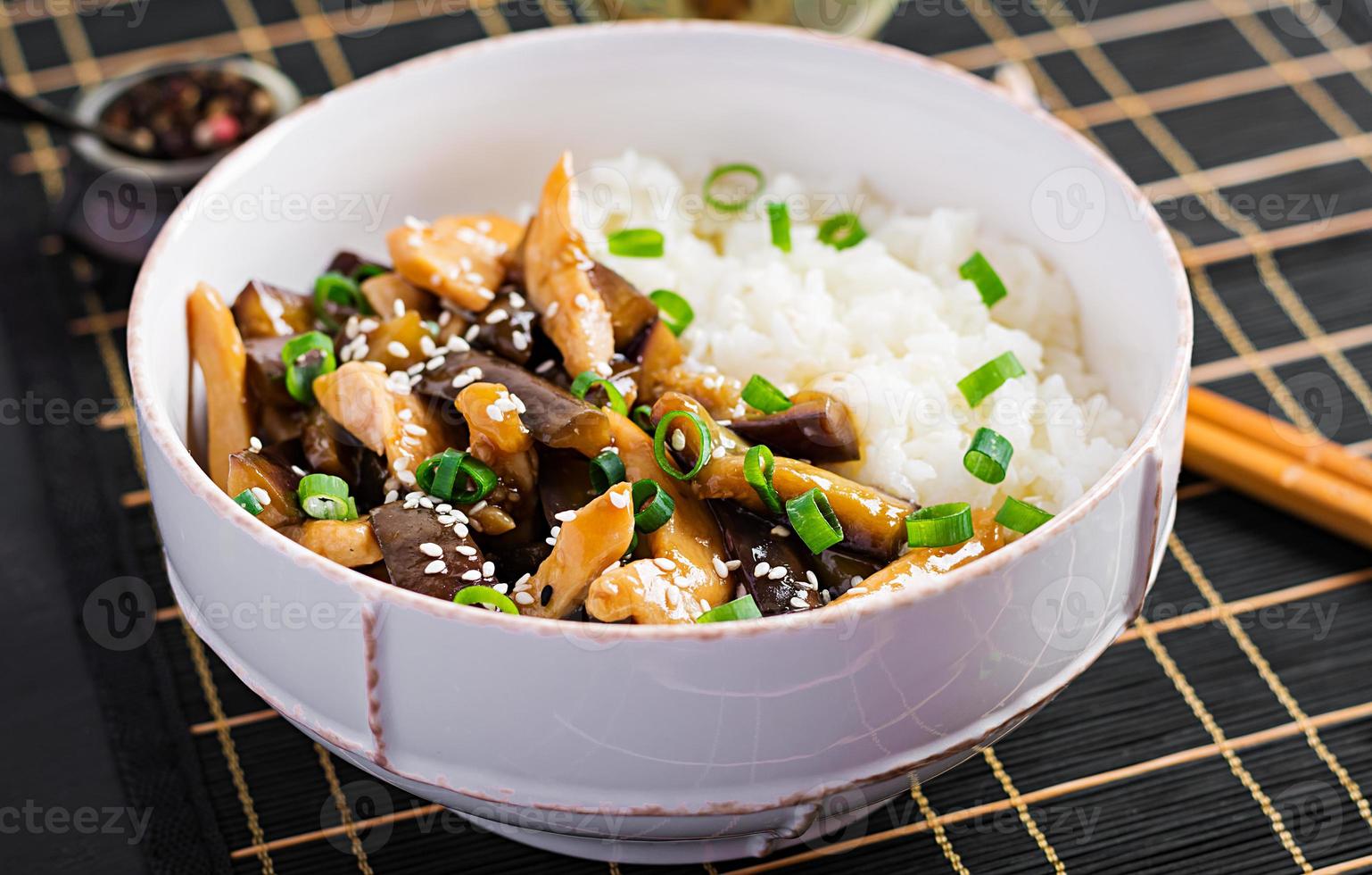 Stir fry with chicken, eggplant and boiled rice - Chinese food photo