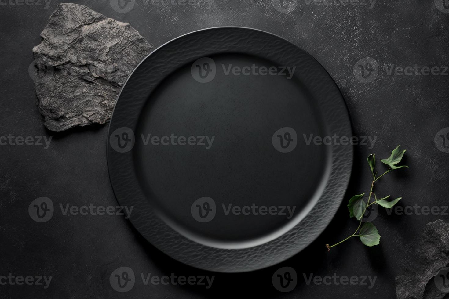 Black plate on stone table top view. Empty space for menu or recipe. photo