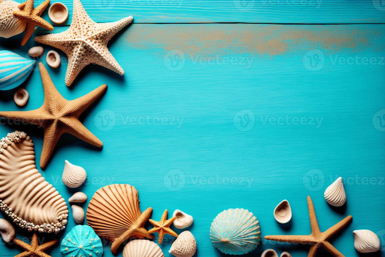 Seashell  starfish and beach sand on blue wooden background. Summer holiday banner. Top view. photo