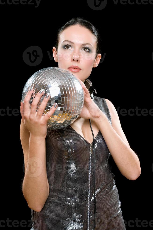 Portrait of young brunette with a mirror ball photo