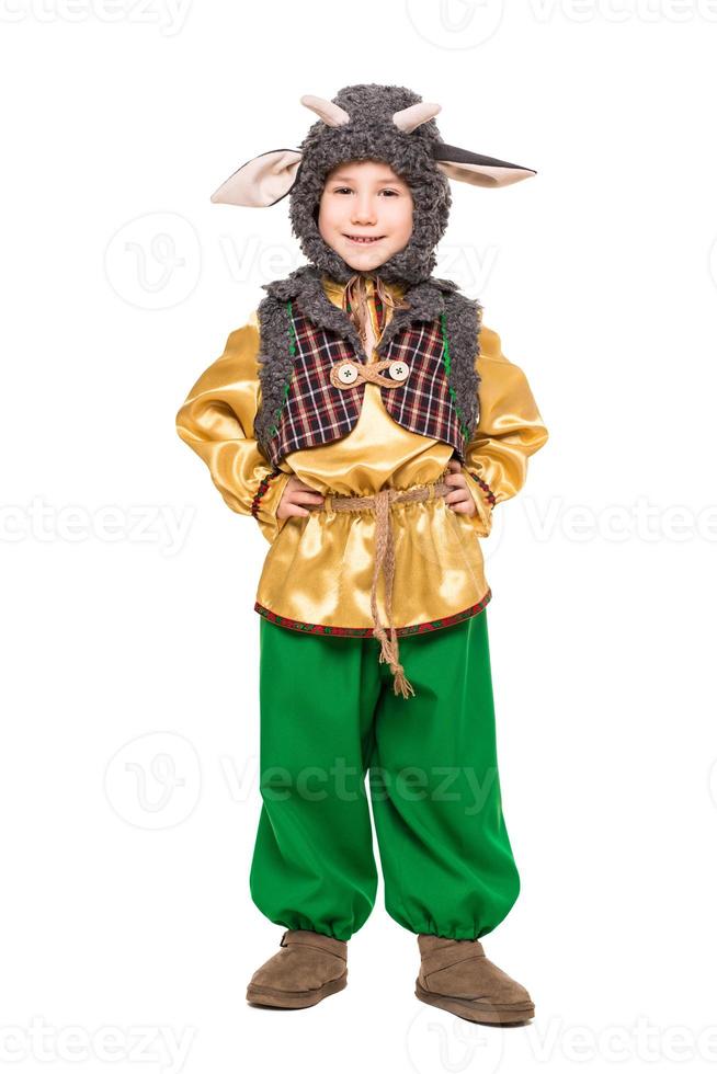 Smiling boy posing in a goat costume photo