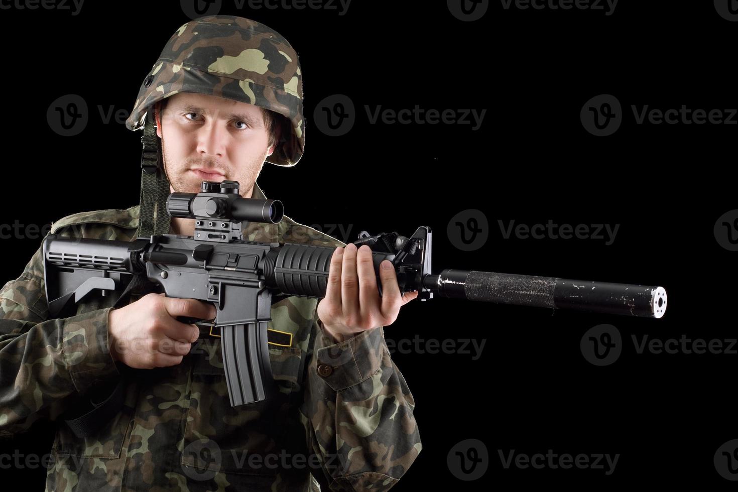 Alerted soldier holding m16 photo