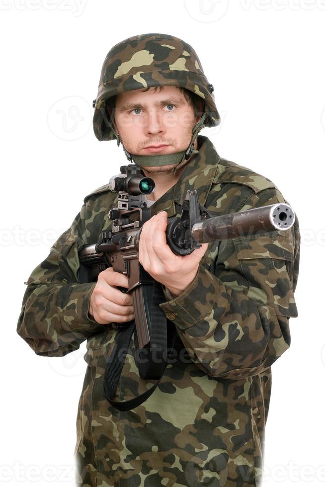 Armed soldier pointing m16. Upperhalf photo