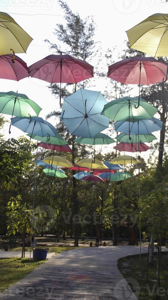 Umbrella hanging at the street decoration to attract people. Outdoor park attraction for spot photo shoot or nice background view.